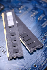 Computer memory RAM on motherboard background . Close up. system, main memory, random access memory, onboard, computer detail. Computer components . DDR3. DDR4. DDR5