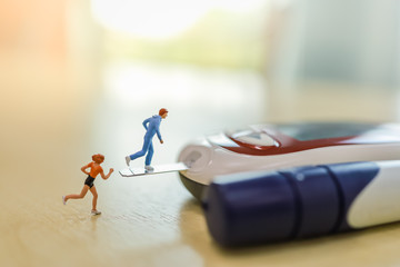 Medicine, diabetes, glycemia, health care and people concept - close up of man and woman runner...