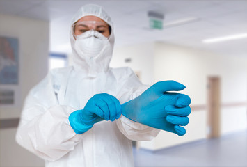 Female doctor wearing  protective suit to fight coronavirus pand