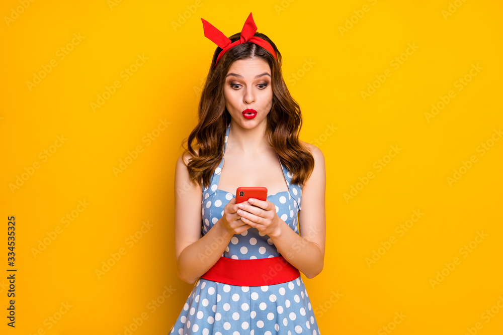 Poster portrait of astonished girl blogger use her cellphone read social network information impressed scre