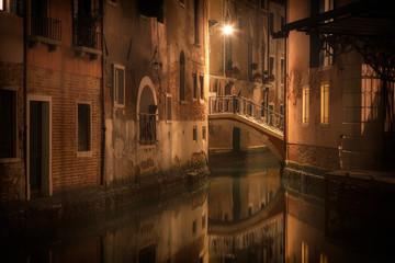 Houses along the canal and the bridge in Venice in night