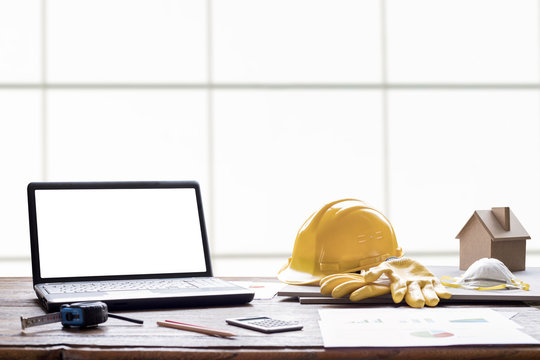 Civil Engineer Helmet And Laptop