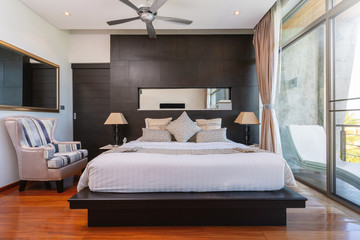 Bedroom with ceiling fan of pool villa, house, home, condo and apartment