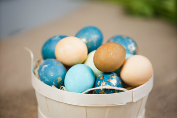 Basket with Easter eggs, festive celebration at home