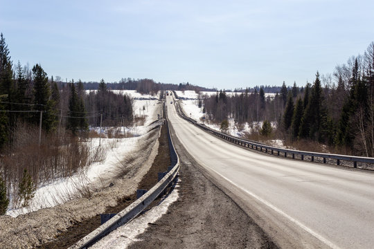 Asphalt road in the forest. A beautiful journey