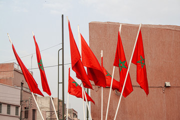 Moroccan flag on mast, with blue sky