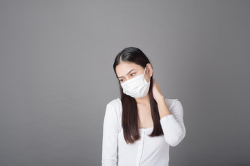 Portrait of woman with surgical mask  in studio, Health care concept