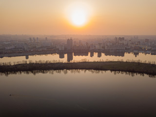 Sunset over the Dnieper River in Kiev. Aerial drone view.