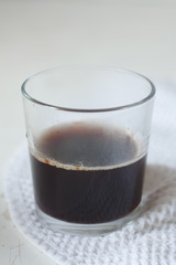 instant coffee in a glass on the kitchen table