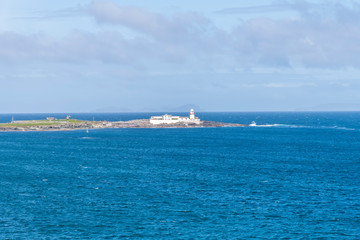 Beautiful view of Valentia Island Lighthouse at Cromwell Point. Locations worth visiting on the Wild Atlantic Way. Scenic Irish countyside on sunny summer day, County Kerry, Ireland.