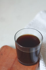 instant coffee in a glass on the kitchen table
