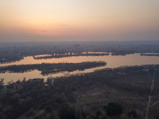 Sunset over the Dnieper River in Kiev. Aerial drone view.