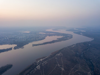 Landscape: blue hour over the Dnieper River in Kiev. Aerial drone view.