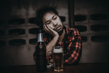 Asian man drink vodka alone at home on night time,Thailand people,Stress man drunk concept