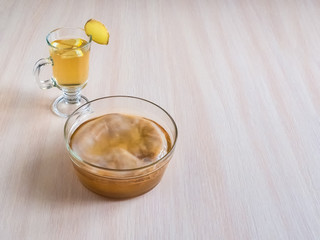 Kombucha fungus with ginger root, honey and lemon.
