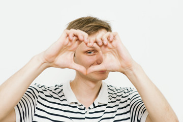 man making a hand heart frame