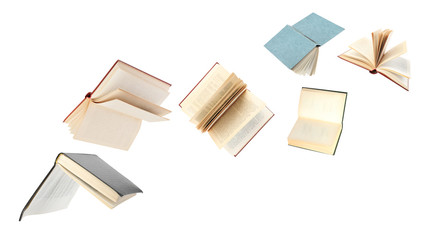 Old hardcover books flying on white background