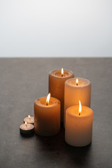 Fototapeta na wymiar Lighted candles on table. Quiet and chill lifestyle concept image. 
