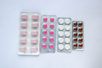 coronavirus concept. pharmaceuticals antibiotics pills medicine colorful antibacterials pills on white background. top view