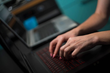 Naklejka na ściany i meble close-up female hands at the computer 4k