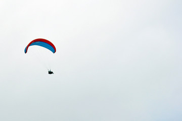 Tandem parachute jump in the background of sky