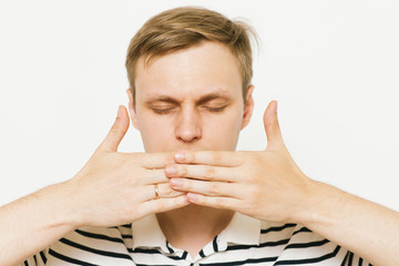 man closes a mouth hands