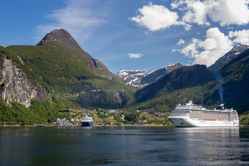 GEIRANGER, NORWAY - 2016 JUNE 14. MSC Musica cruise vessel anchorage inside the Norwegian fjord Geiranger.