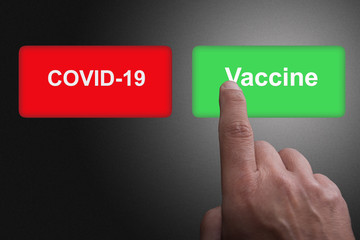 COVID-19 Virus Vaccine discovery or antibodies research success concept, Red and green buttons with Covid-19 and Vaccine text