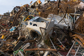Detail of a huge mountain of mainly metal garbage and appliances in a junkyard