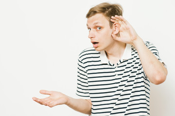 Overhears a man, tries to listen.