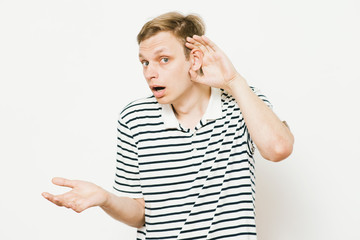 Overhears a man, tries to listen.