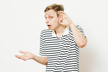Overhears a man, tries to listen.