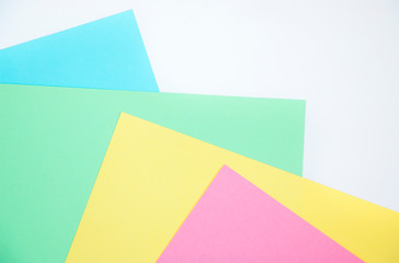 Multi-colored sheets of paper. Geometric background image. Creative template for your text.