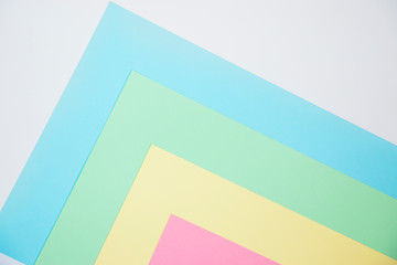 Multi-colored sheets of paper. Geometric background image. Creative template for your text.