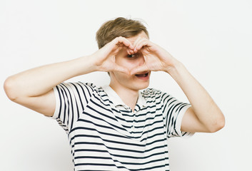 man making a hand heart frame