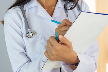 Doctor Writing On Medical Document