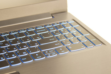 Close-up of laptop keyboard Close-up of laptop keyboard backlight, cyrillic keyboard with blue backlightbacklight, blue backlit keyboard.