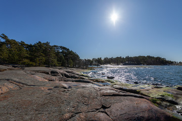 Sunny day and slippery rocky beach.