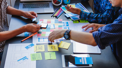 Soft Focus and Blur,A group of web designers are working together to develop a mobile responsive website with UI UX Front End Designer Previewing. Website development concept UI UX front end designer 