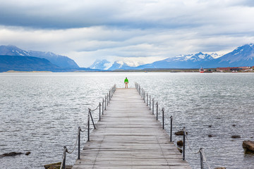 Tourist woman on old pier at Puerto Natales - Chile