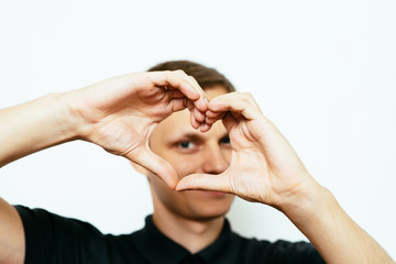 Fototapeta premium man making a hand heart frame