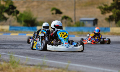 Young go cart racer on circuit