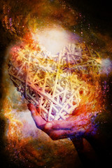 Woman and white heart in your hand on abstract structured space background.