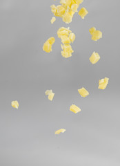 Falling cheese on white background