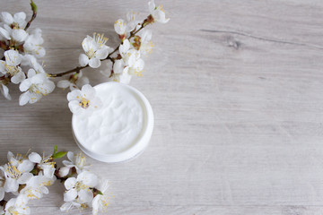 Fototapeta na wymiar Natural cosmetics for face skin care, cherry blossom