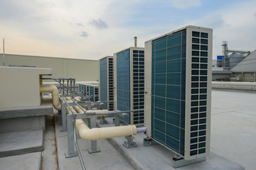 Air condensing unit machine part of air conditioner system on the rooftop in the factory