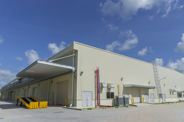 Newly industrial warehouse building with blue sky