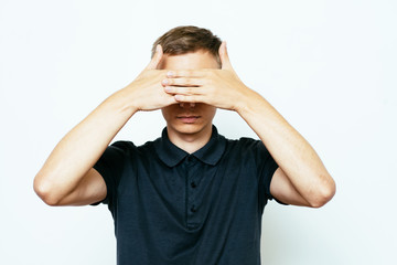 Naklejka premium Man closes eyes with her hands