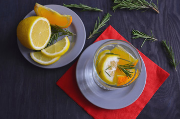 Summer healthy lemonade, cocktails made from citrus water or mojito infusion, with lime, lemon, orange, ice and mint, diet drinks. Antioxidant in healthy food.