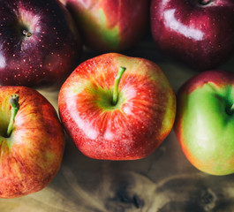 Top view of a variety of apples including gala, red delicious and honeycrisp. 